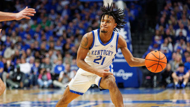 Nov 24, 2023; Lexington, Kentucky, USA; Kentucky Wildcats guard D.J. Wagner (21) passes the ball during the second half against the Marshall Thundering Herd at Rupp Arena at Central Bank Center. Mandatory Credit: Jordan Prather-USA TODAY Sports